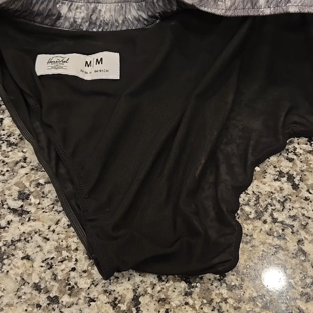 HERSCHEL SUPPLY CO. GREY SWIM TRUNKS. SIZE MEDIUM . 33-36 INCHES.